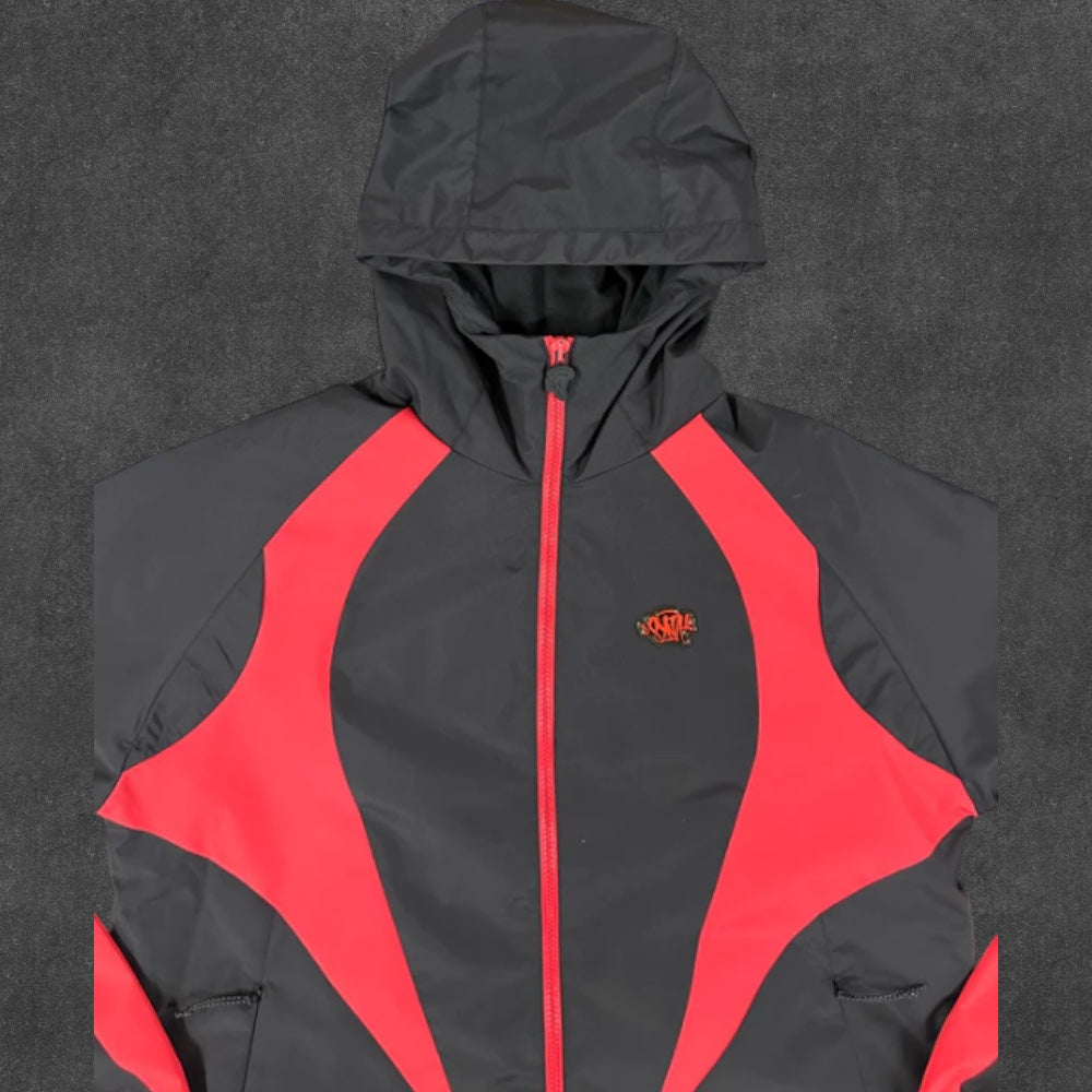 SYNA WORLD VORTEX WOVEN JACKET [BLACK/RED]